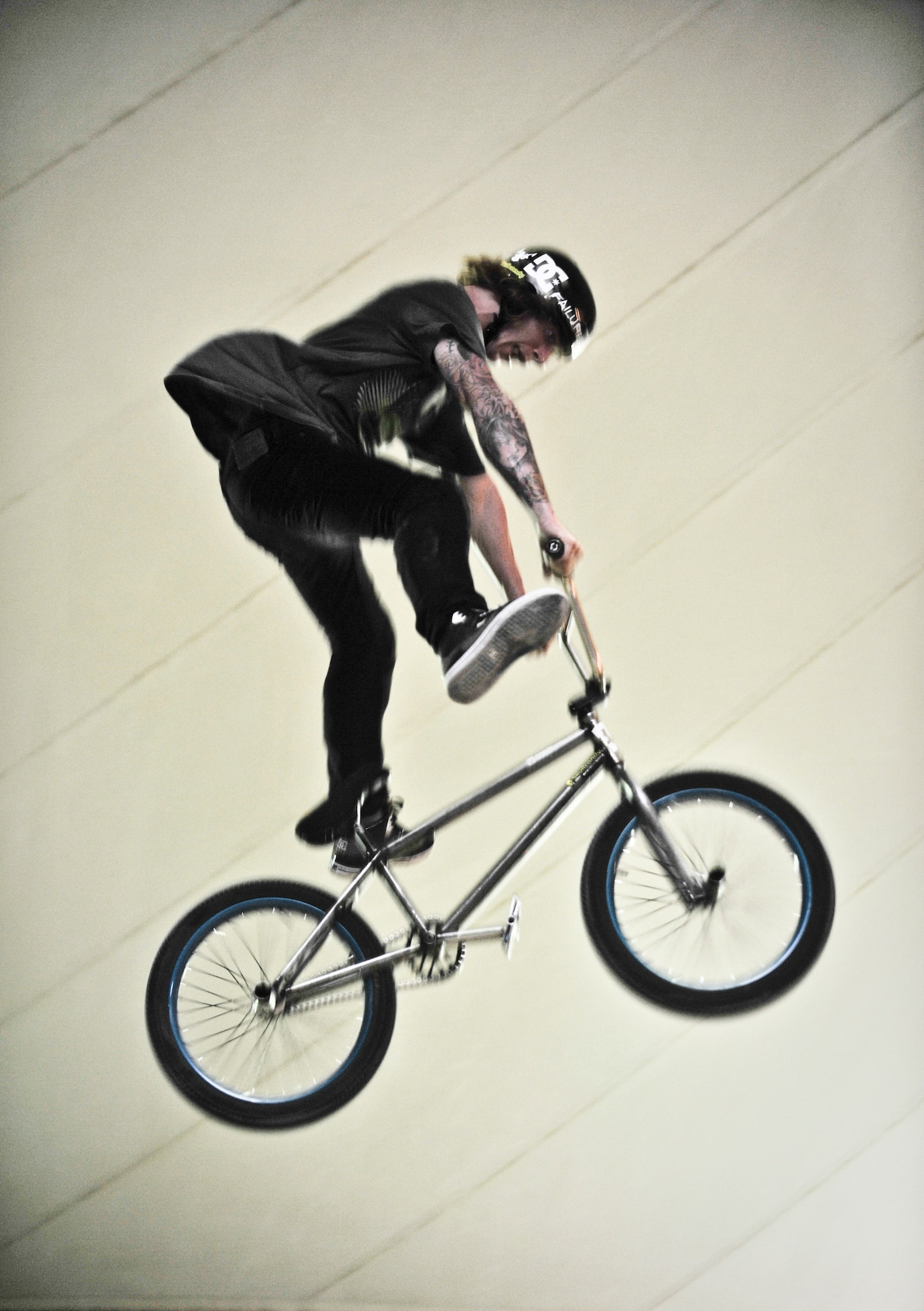 Jeremiah Smith performs an aerial stunt for deployed servicemembers during the “Bikes over Baghdad” event, Sept. 24, 2011, at an undisclosed location in Southwest Asia. (U.S. Air Force photo/Senior Airman Paul Labbe)