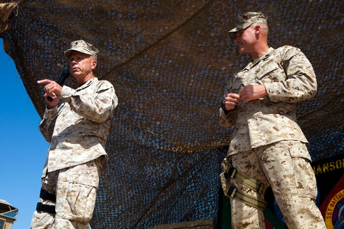 A soldier with the Afghan National Army 215th Corps Logistics Battalion proudly displays his certificate of graduation during a ceremony at Camp Shorabak, Afghanistan, Sept. 26, 2011.  Approximately 25 students graduated from the nine-week course, which included classes in maintenance and medical procedures, logistics, tactics and field cooking.  (U.S. Marine Corps photo by Cpl. Katherine M. Solano)