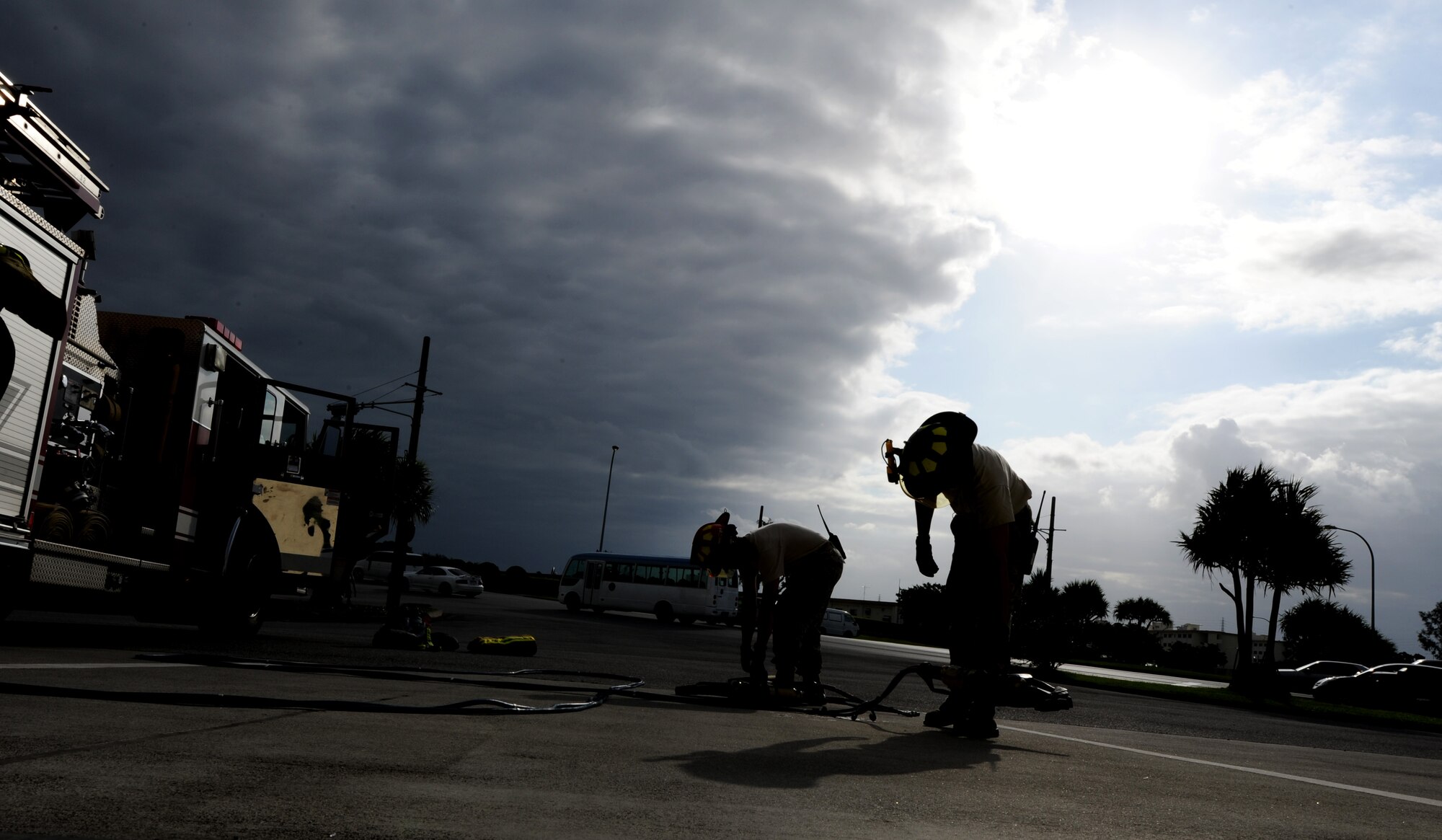 Senior Airman Sean Murphy and Staff Sgt. Robert Jarvis, both 18th Civil Engineer Squadron firemen, test hydraulic equipment at the start of their duty shift at Fire Station 1 on Kadena Air Base, Japan, Sept. 21. This hydraulic equipment is primarily used to cut vehicles open in order to extract victims in motor vehicle accidents. (U.S. Air Force photo/Airman 1st Class Jarvie Z. Wallace)
