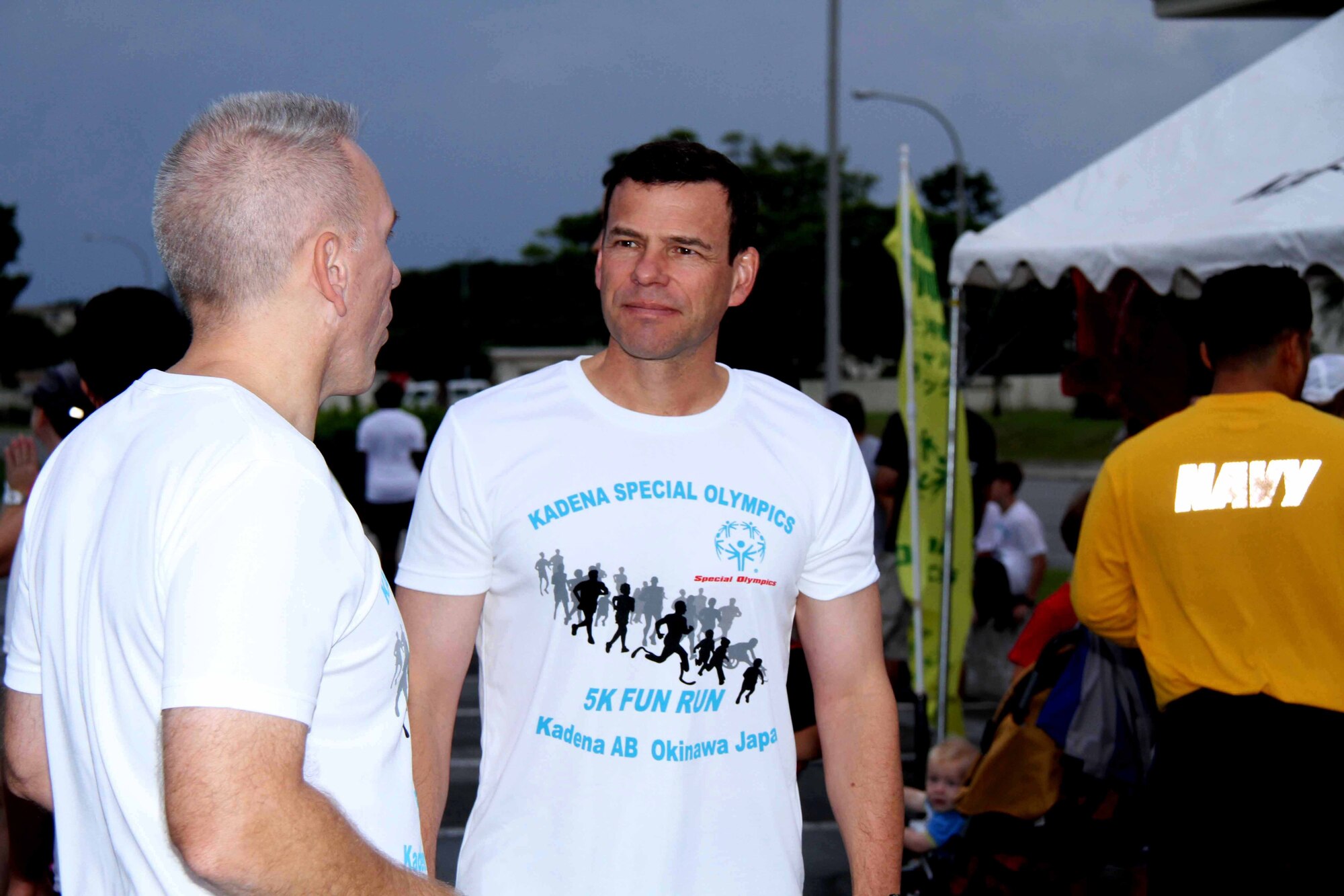 Brig. Gen. Matt Molloy, 18th Wing commander,(right) converses with Col. Roftiel Constantine, 18th Mission Support Group commander prior to the Kadena Special Olympics Fun Run at Kadena Air Base, Japan, Sept. 24. More than 400 Airmen, Soldier, Sailors and Marines joined together with civilian to participates in the 12th Annual Kadena Special Olympics Fun Run. Kadena Special Olympics is the largest community outreach program in the pacific with close to 1,300 special-needs athletes and artists from 44 schools on the island. (U.S. Army photo/Chip Steitz)