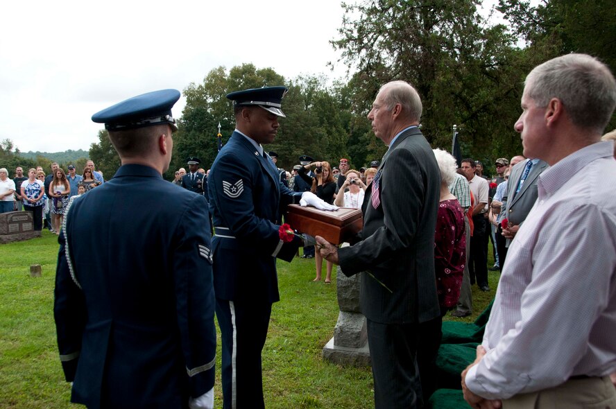 An Air Force honor guard team from Joint Base McGuire-Dix-Lakehurst, N.J., participates in a burial ceremony honoring Maj. Bruce Lawrence Sept. 24, 2011 at a cemetery in Easton, Pa., approximately 43 years after his aircraft was shot down in Vietnam. Lawrence’s remains were recovered and positively identified through the Joint POW/MIA Accounting Command. (U.S. Air Force photo/2nd Lt. Michael Gibson)