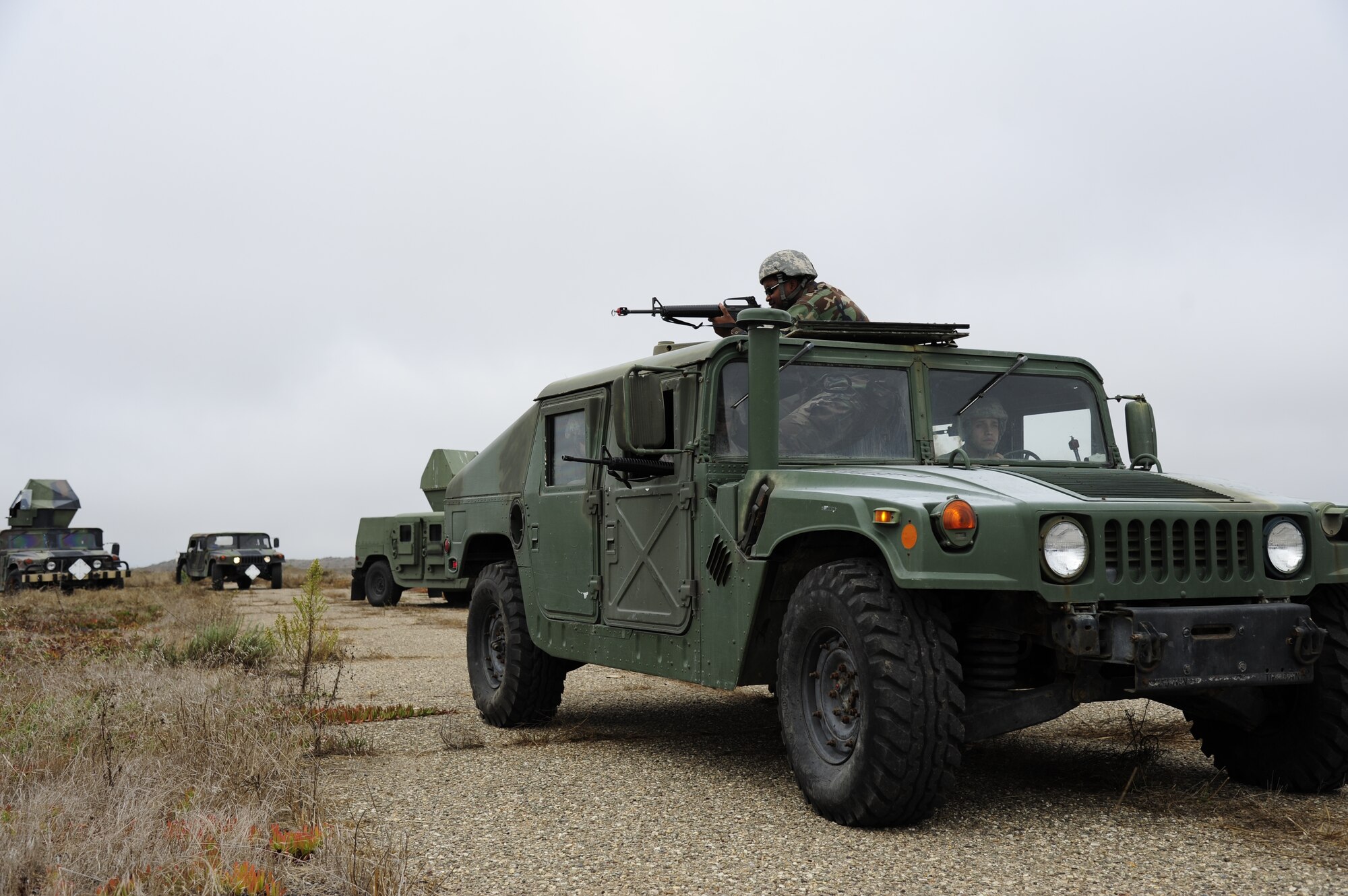 VANDENBERG AIR FORCE BASE, Calif. - A line of vehicles roll by during a civil engineer convoy exercise here Thursday, Sept. 22, 2011. The 30th CES conducts monthly training in order to better prepare its Airmen for the tasks they are traditionally commanded to perform while deployed. (U.S. Air Force photo/Senior Airman Lael Huss)