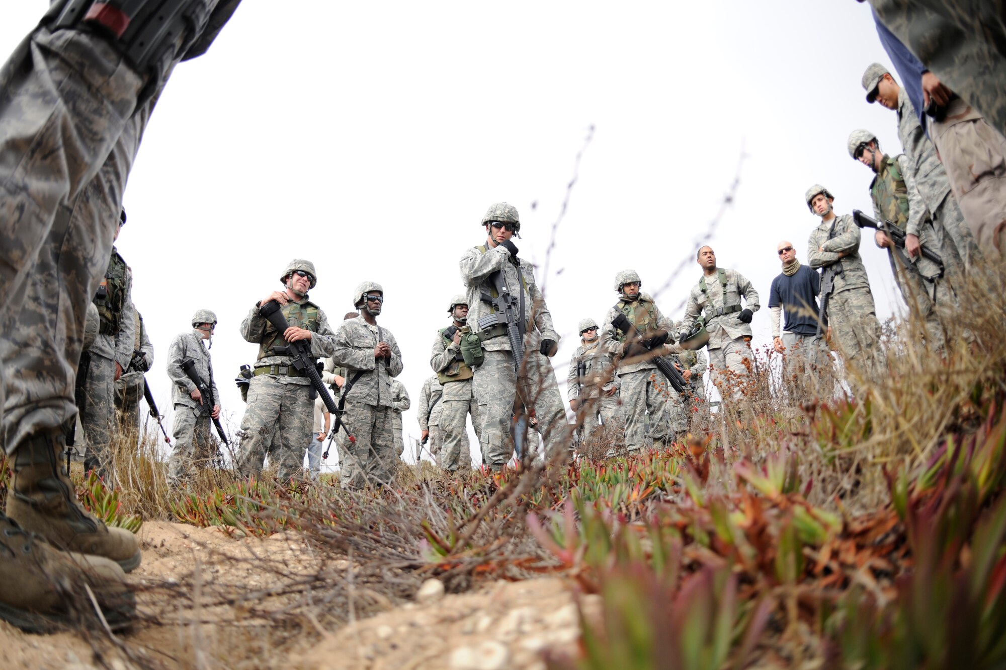 VANDENBERG AIR FORCE BASE, Calif. -- Members of the 30th Civil Engineer Squadron listen to a debriefing after a 30th CES convoy exercise here Thursday, Sept. 22, 2011.  The 30th CES members trained to aid and prepare themselves for future deployment operations.  (U.S. Air Force photo/Staff Sgt. Andrew Satran) 
