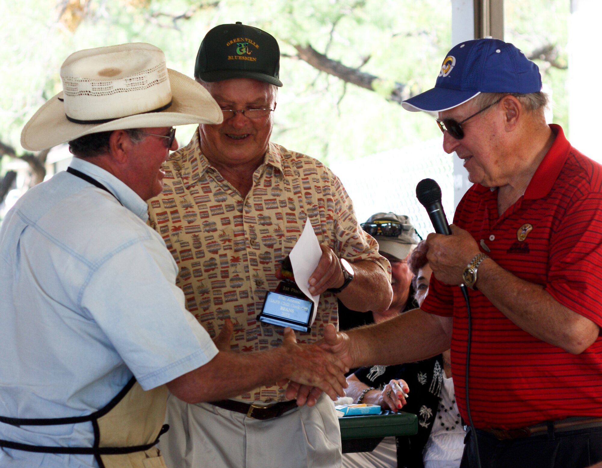 SAN ANGELO, Texas -- Johnny Pennell accepts the first place trophy in the Baked Beans category for team Hooking Bull during the 38th Annual Armed Forces Chili Cookoff at the Recreation Camp Sept. 24. (Courtesy photo/Whitney Haskell)