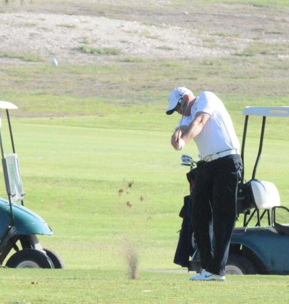 LAUGHLIN AIR FORCE BASE, Texas – Travis Mariner, of the radio station KDLK in Del Rio, tees off at Laughlin’s Leaning Pine Golf Course Sept. 24 during the annual Commander’s Golf Tournament. The tournament was played with four-man teams in a “best ball” style, meaning only the best score from each team member on each hole was counted. (U.S. Air Force photo/Senior Airman Scott Saldukas)  