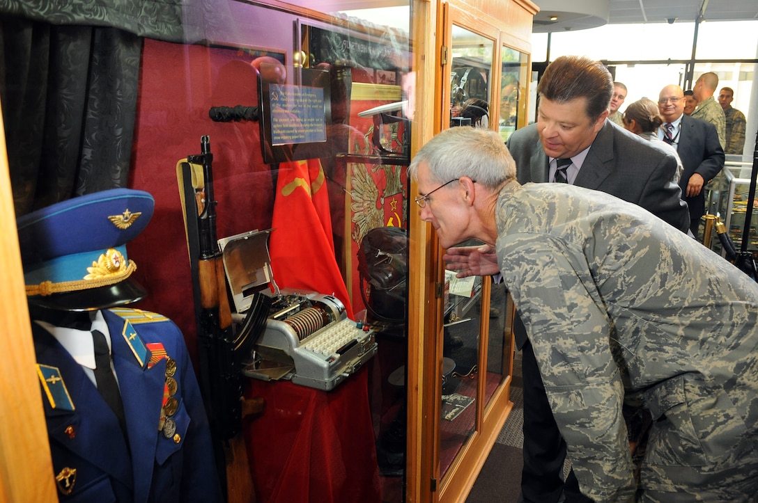 Maj. Gen. Robert Otto, Air Force ISR Agency commander, gets a close look Sept. 22, at a Fialka, a Cold War-era cipher machine, as Gabe Marshall of the AFISRA History Office explains some of its features. (Photo by William Belcher)  
