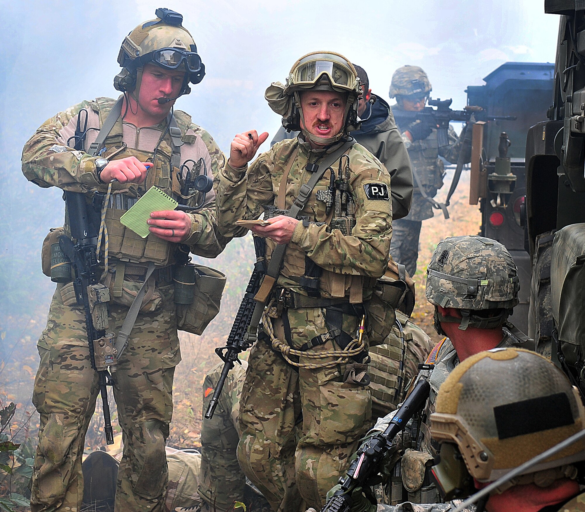 1st Lt. Aaron Hunter (left), 212th Rescue Squadron combat rescue officer, and Tech. Sgt. Brandon Stuemke, 212th Rescue Squadron pararescueman, acsses the scene upon arrival during training at Joint Base Elmendorf-Richardson on September 21, 2011.  The training focused on quick-care-under-fire and also gave training to Baker Company, 3rd Battalion (Airborne), 509th Infantry Regiment, on how to react when pararescuemen arrive.  (U.S. Air Force photo/Staff Sgt. Zachary Wolf) 