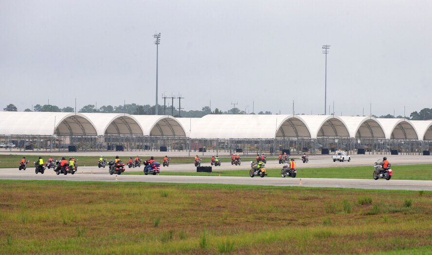 Team Moody motorcyclists ride their bikes on the flightline after an annual post-season safety briefing at Moody Air Force Base, Ga., Sept. 23, 2011. The 23rd Wing safety office organized the ride to celebrate the Year of the Motorcycle. The flightline ride was the first of its kind at Moody. (U.S. Air Force photo by Senior Airman Stephanie Mancha/Released)