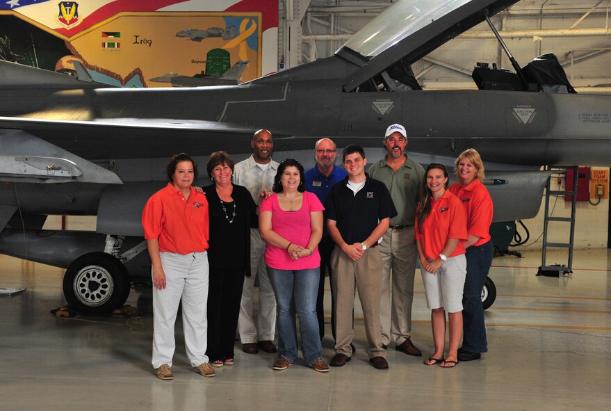 20th Force Support Squadron members and local area vendors pose in front of an F-16 Fighting Falcon at the 55th Fighter Squadron on Shaw Air Force Base, S.C. Sept. 22, 2011. Sales representatives of local attractions and lodging were invited to tour Shaw and participate in a day of fun in honor of Vendor Appreciation Day. The event is held annually in order to thank local businesses for their continued support of the military and showcase the deals that they extend to service members and their families. (U.S. Air Force photo by Airman 1st Class Amber E. N. Jacobs/Released)