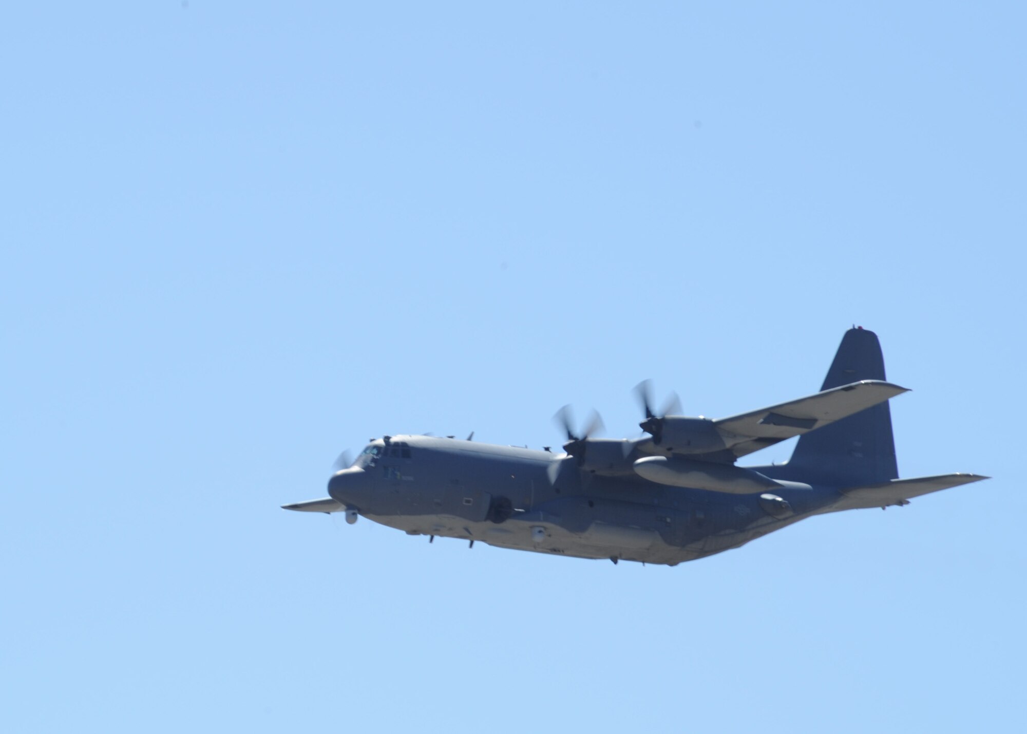 A 73rd Special Operations Squadron MC-130W Dragon Spear flies over over the second annual open house at Cannon Air Force Base, N.M.m Sept. 24, 2011.  The open house featured 27th Special Operations Wing and Air Force Special Operations Command personnel, units and assets as well as other special operations units.  (U.S. Air Force photo by Senior Airman James Bell)