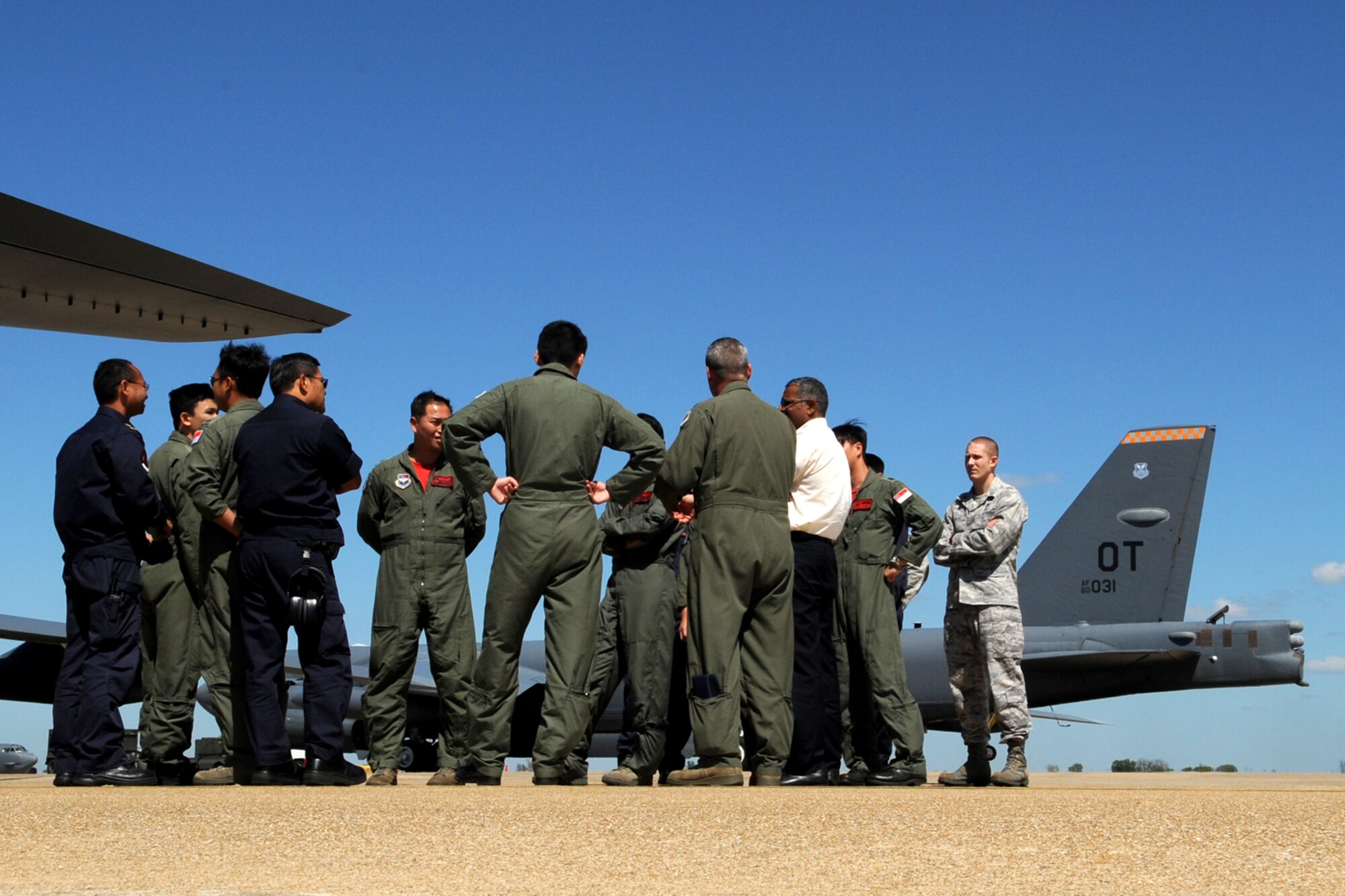 Personnel from the 425th Fighter Squadron (FS), who are on temporary duty to Barksdale Air Force Base, La., in support of a Green Flag exercise, get a tour of a B-52 Stratofortress, Sept. 23, 2011. The 425th FS, assigned to Luke Air Force Base, Ariz., provides advanced weapons and tactics training for Republic of Singapore F-16 pilots and maintenance personnel. Green Flag is an exercise designed to prepare pilots for combined, air, ground and electronic threat environments. (U.S. Air Force photo by Master Sgt. Greg Steele/Released)