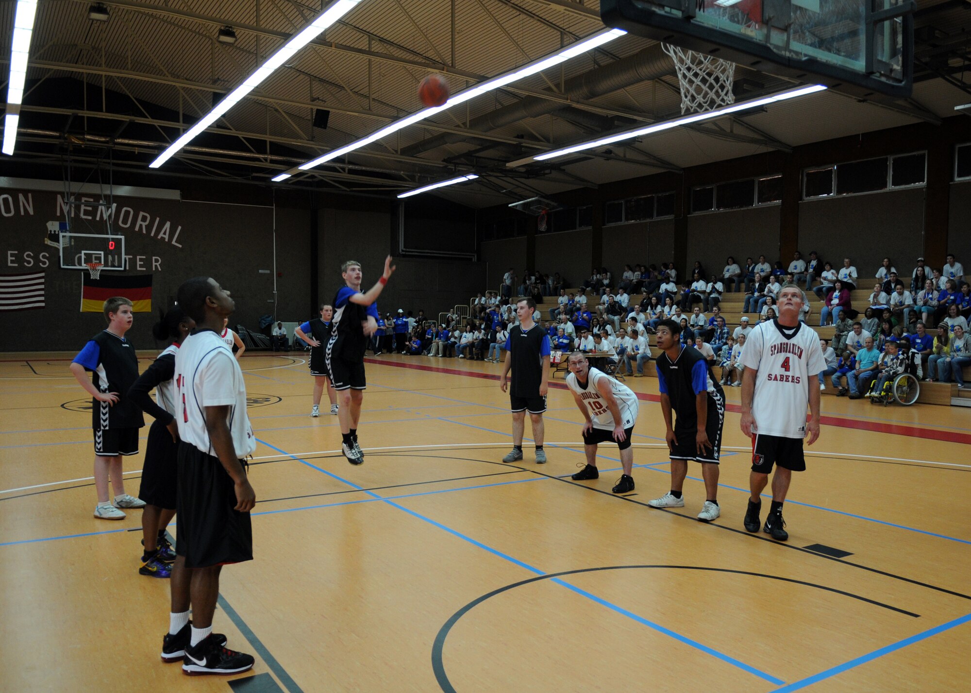SPANGDAHLEM AIR BASE, Germany – A player from St. Martin’s School shoots a free throw during a basketball game against the Spangdahlem Sabers at the Skelton Memorial Fitness Center during the annual St. Martin’s Special Children’s Day here Sept. 22. The St. Martin’s School upset the Sabers 24 - 18. This game was one of the many activities where Airmen partnered up with children from the Bitburg school hosted by the air base. (U.S. Air Force photo/Senior Airman Christopher Toon) 