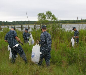 Sailors from Naval Nuclear Power Training Command clean the creeks and riverbeds around Marrington Plantation Sept. 16. The Sailors removed more than 500 pounds of trash and debris from 2.4 miles of Joint Base Chareston - Weapons Station waterways as part of River Sweep, the annual statewide litter clean-up campaign. (U.S. Navy photo/Terrence Larimer)