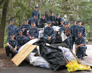 Sailors from Naval Nuclear Power Training Command relax after three hours of cleaning the creeks and riverbeds around Marrington Plantation Sept. 16. The Sailors removed more than 500 pounds of trash and debris from 2.4 miles of Joint Base Chareston - Weapons Station waterways as part of River Sweep, the annual statewide litter clean-up campaign. (U.S. Navy photo/Terrence Larimer)