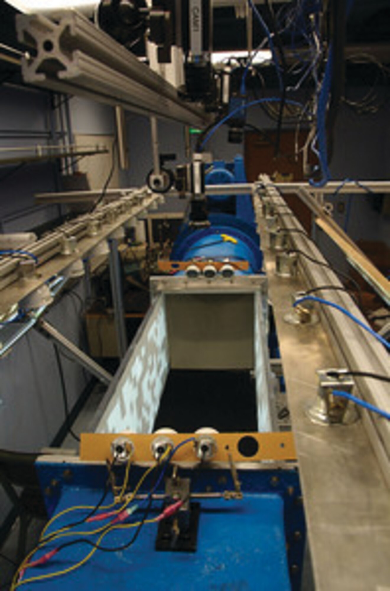 A virtual reality tunnel for fruit flies allows simultaneous tracking of freely flying flies and computer-projected imagery on the walls and floor of the arena.  AFRL-funded research at Caltech is studying altitude control in flying insects, hoping to transfer that knowledge to Air Force aircraft.  (Credit: Dr. Andrew Straw, Caltech)