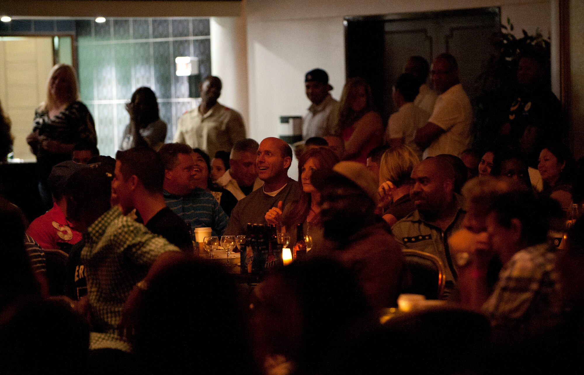 Airmen and families react to comedians during the BET All Star Comedy Show, Sept. 23, 2011, at the Club Complex, Incirlik Air Base, Turkey. The comedy show visits several venues across Europe. (U.S. Air Force photo by Senior Airman Clayton Lenhardt/Released)