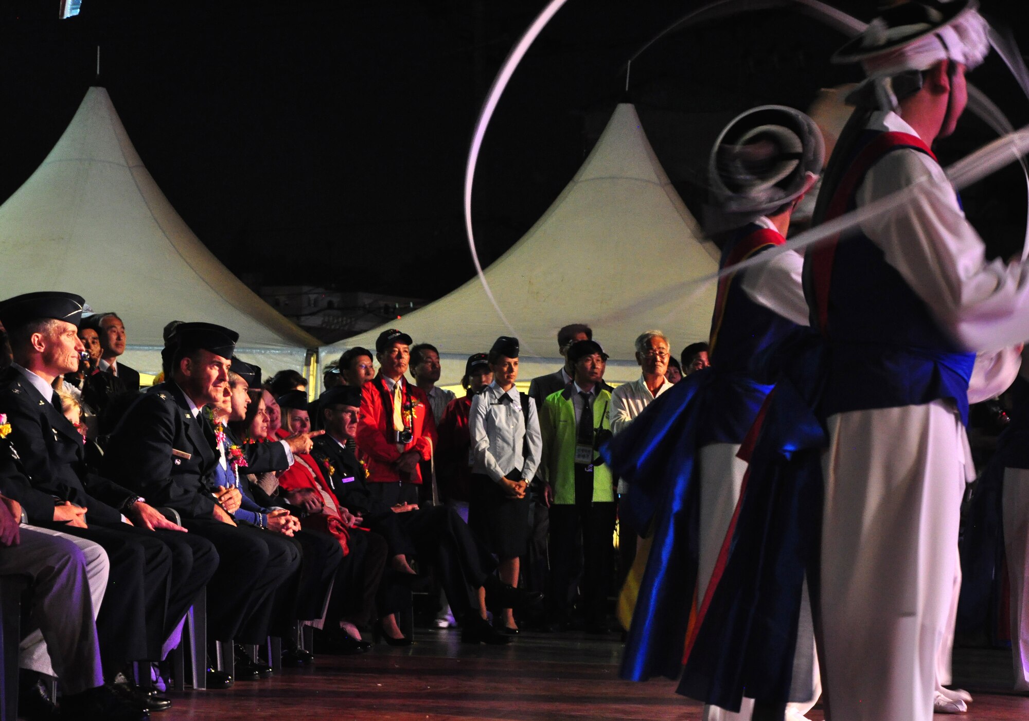 Members of the 51st Fighter Wing leadership watch a dance performance Sept. 24, 2011, at the eighth annual Korean American Friendship Cultural Festival. The festival was sponsored by the Songtan Chamber of Commerce and celebrates the great friendship between Koreans and Americans. (U.S. Air Force photo/Tech. Sgt. Chad Thompson)