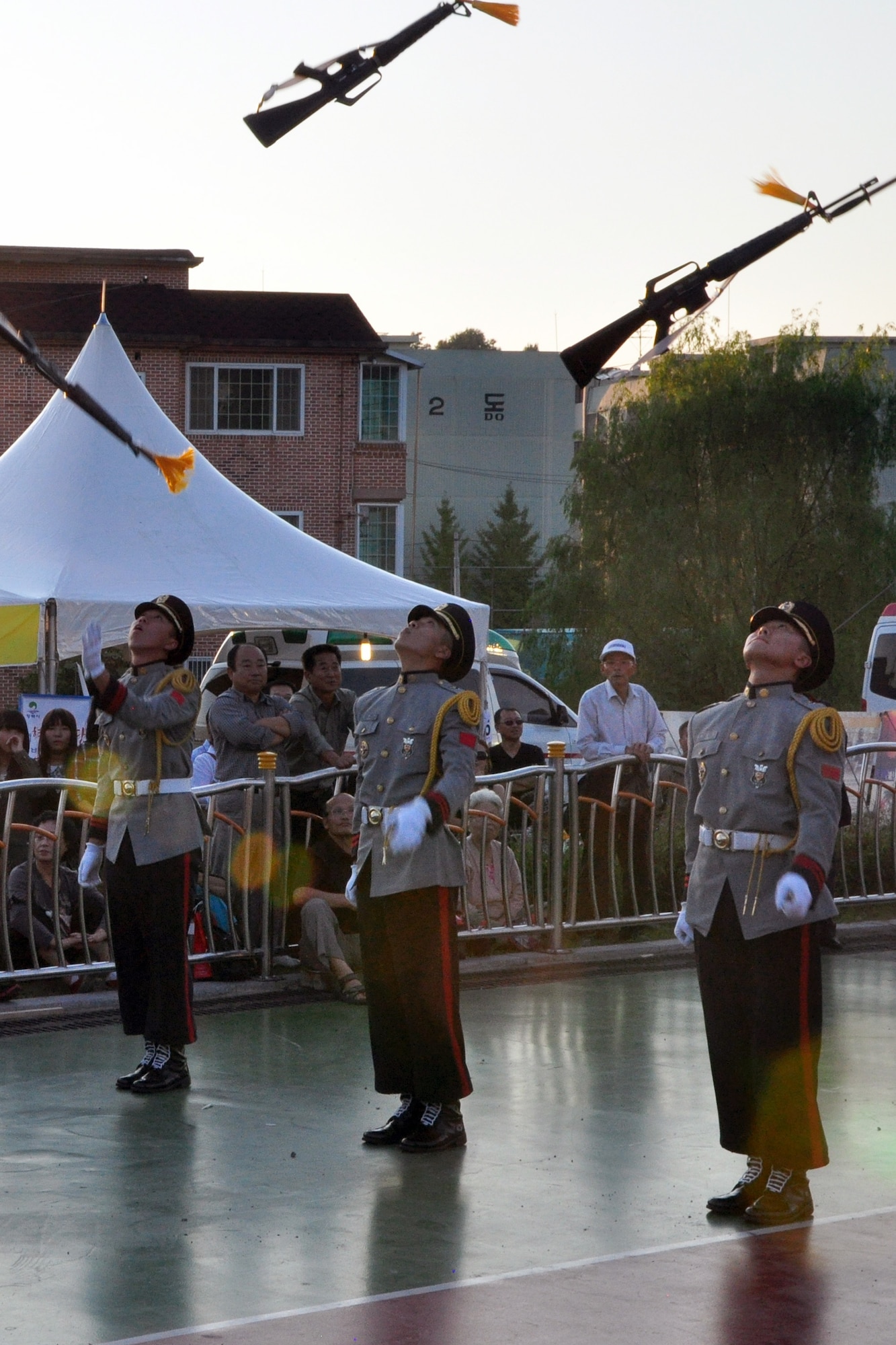 A Korean military honor guard performs a rifle drill demonstration Sept. 24, 2011, during the eighth annual Korean American Friendship Cultural Festival. The festival was sponsored by the Songtan Chamber of Commerce and celebrates the great friendship between Koreans and Americans. (U.S. Air Force photo/Tech. Sgt. Chad Thompson)