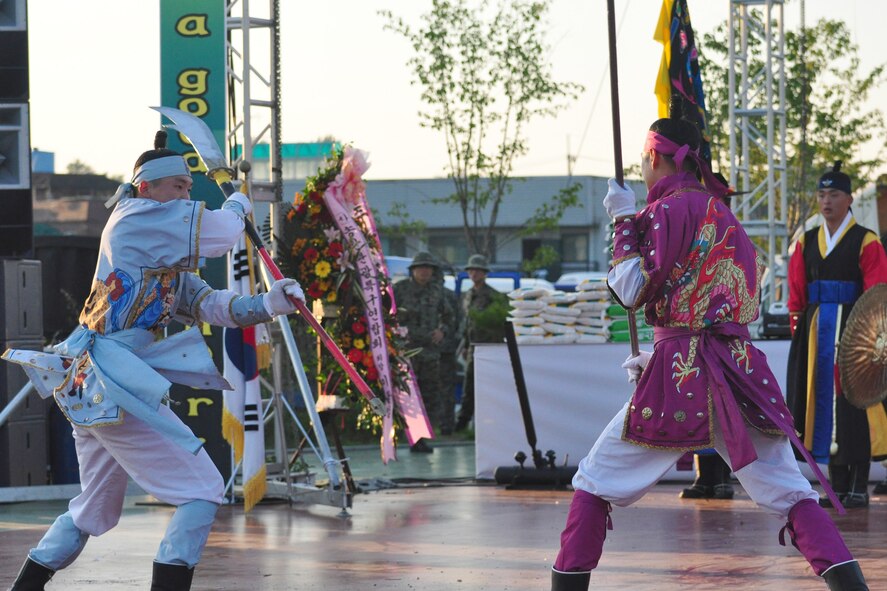 Koreans dressed in traditional military clothing fight during a martial arts performance Sept. 24, 2011, during the eighth annual Korean American Friendship Cultural Festival. The festival was sponsored by the Songtan Chamber of Commerce and celebrates the great friendship between Koreans and Americans. (U.S. Air Force photo/Tech. Sgt. Chad Thompson)