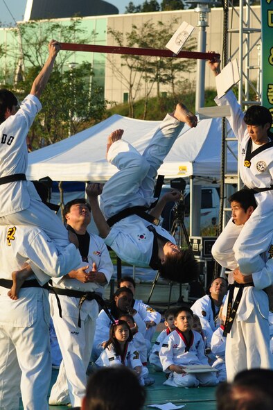 A Taekwondo student flips and breaks a board during a martial arts performance Sept. 24, 2011, during the eighth annual Korean American Friendship Cultural Festival. The festival was sponsored by the Songtan Chamber of Commerce and celebrates the great friendship between Koreans and Americans. (U.S. Air Force photo/Tech. Sgt. Chad Thompson)
