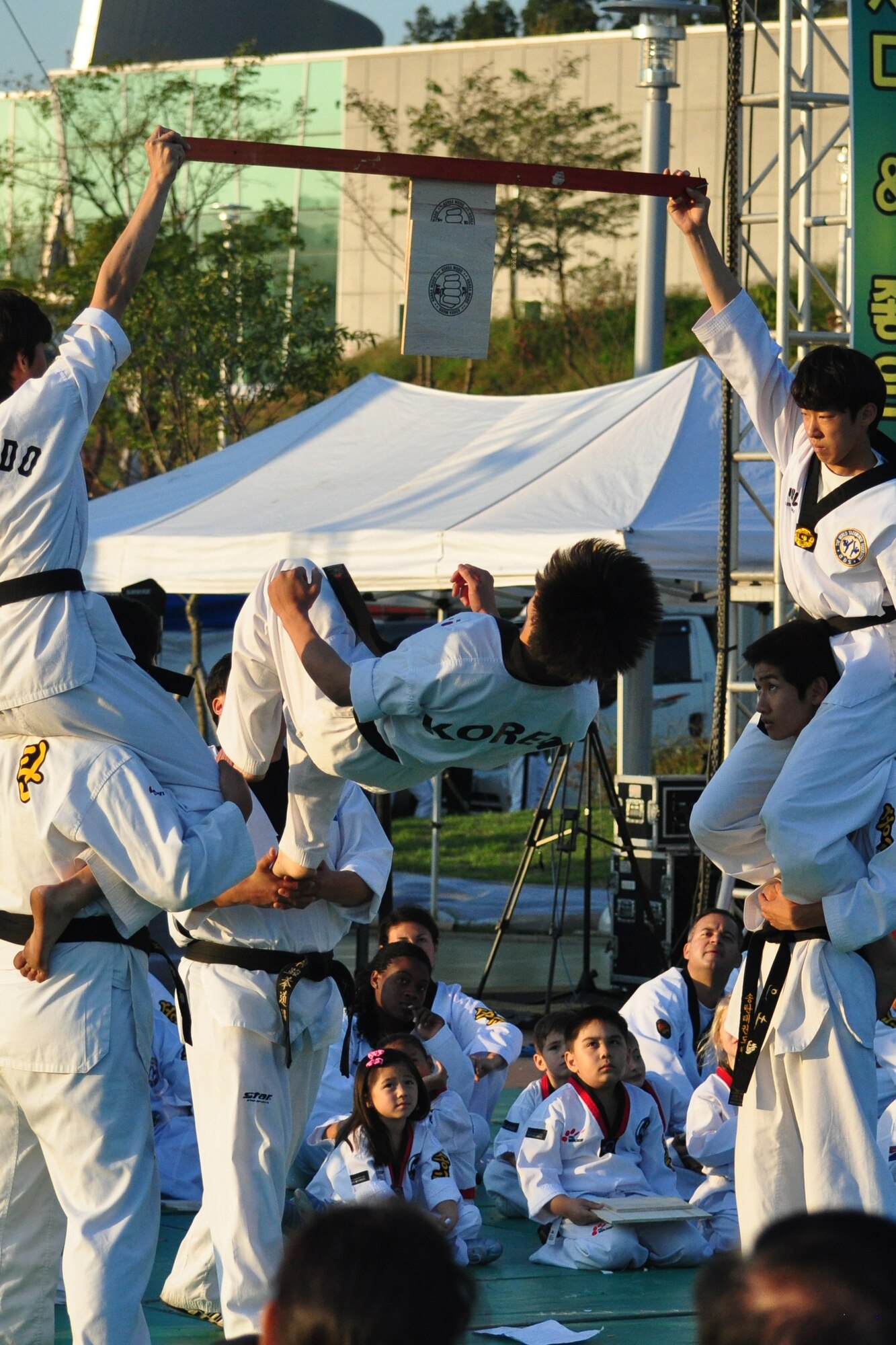 A Taekwondo student flips to break a board during a martial arts performance Sept. 24, 2011, during the eighth annual Korean American Friendship Cultural Festival. The festival was sponsored by the Songtan Chamber of Commerce and celebrates the great friendship between Koreans and Americans. (U.S. Air Force photo/Tech. Sgt. Chad Thompson)