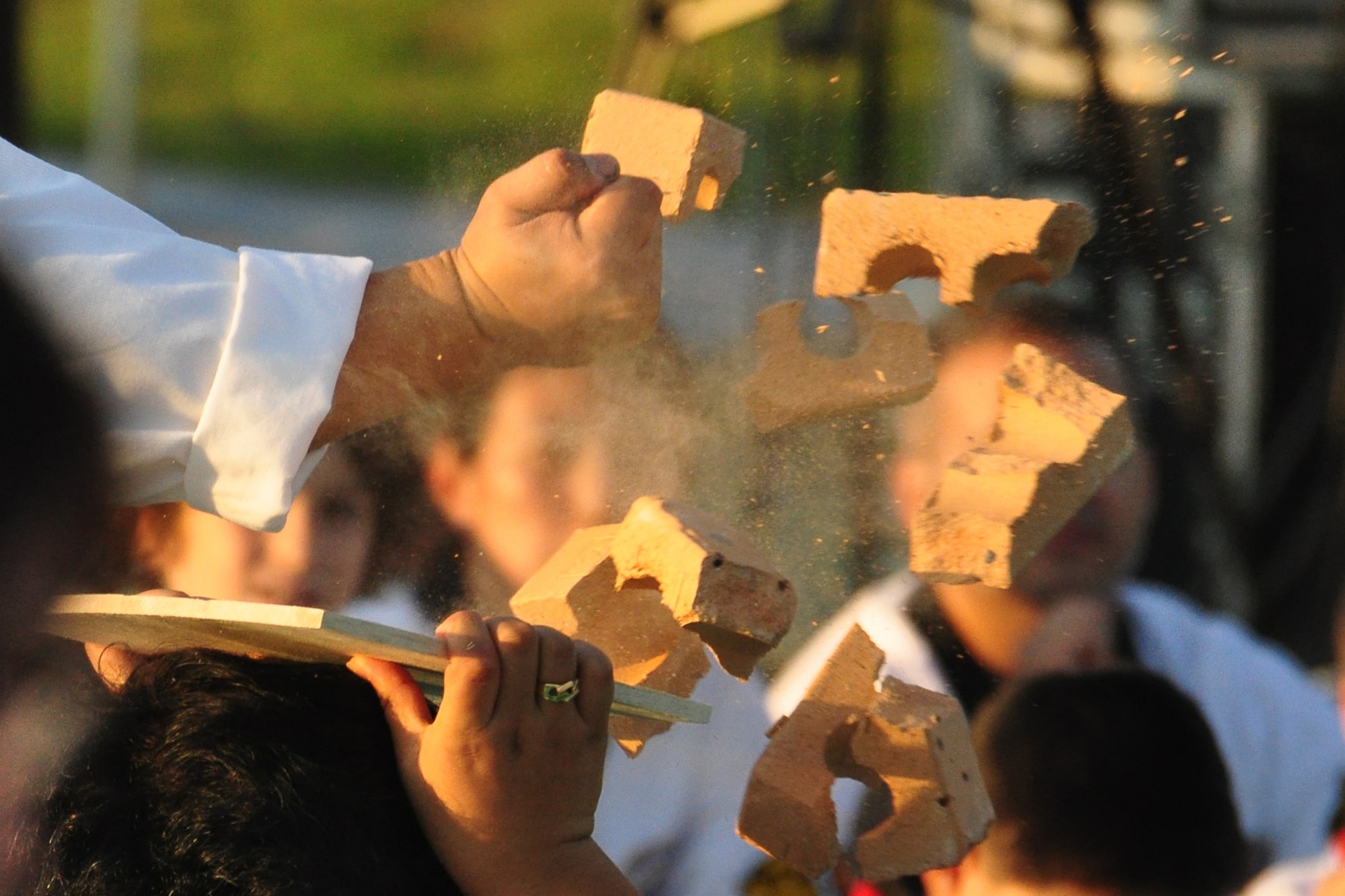 A Taekwondo instructor breaks bricks during a martial arts performance Sept. 24, 2011 during the eighth annual Korean American Friendship Cultural Festival. The festival was sponsored by the Songtan Chamber of Commerce and celebrates the great friendship between Koreans and Americans. (U.S. Air Force photo/Tech. Sgt. Chad Thompson)