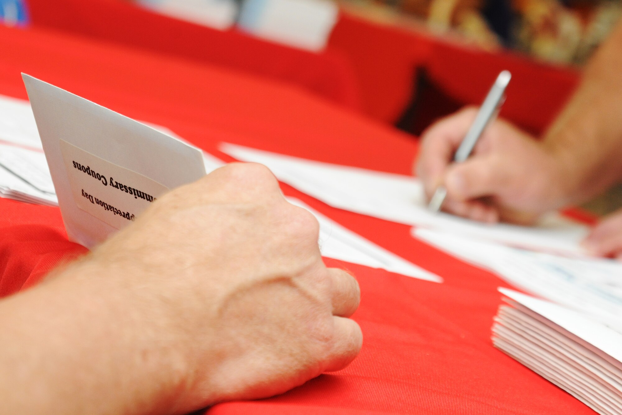 KUNSAN AIR BASE, Republic of Korea -- Retired servicemembers fill out information form during Retiree Day here Sept. 24. Days like this are a great source of the latest information for retirees and their family members. (U.S. Air Force photo/Senior Airman Brittany Y. Bateman)