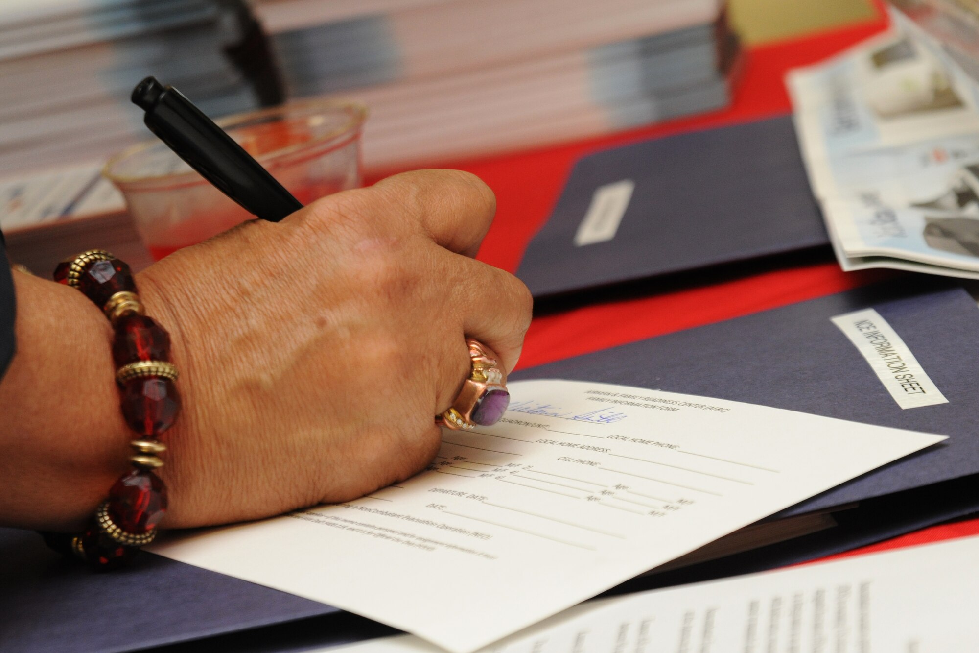 KUNSAN AIR BASE, Republic of Korea -- Retired servicemembers fill out information form during Retiree Day here Sept. 24. Days like this are a great source of the latest information for retirees and their family members. (U.S. Air Force photo/Senior Airman Brittany Y. Bateman)