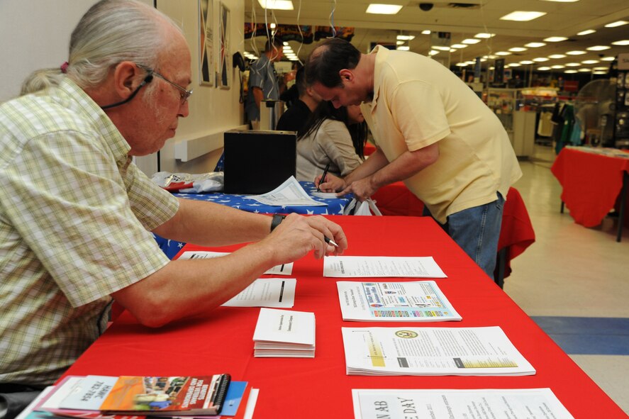 KUNSAN AIR BASE, Republic of Korea -- Retired servicemembers fill out information form during Retiree Day here Sept. 24. Days like this are a great source of the latest information for retirees and their family members. (U.S. Air Force photo/Senior Airman Brittany Y. Bateman)