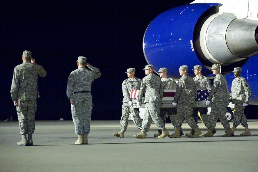 A U.S. Army carry team transfers the remains of Army Pfc. Carlos A. Aparicio of San Bernadin, Calif., at Dover Air Force Base, Del., Sept. 25, 2011. Aparicio was assigned to the 2nd Battalion, 4th Infantry Regiment, 4th Brigade Combat Team, 10th Mountain Division, Fort Polk, La. (U.S. Air Force photo/Adrian Rowan)
