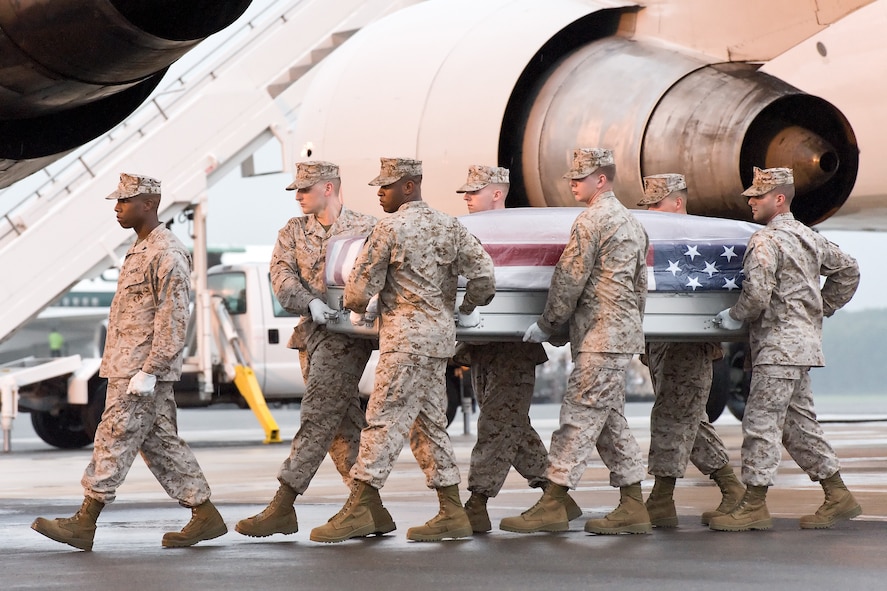 A U.S. Marine Corps carry team transfers the remains of Marine Lance Cpl. Franklin N. Watson, of Vonore, Tenn., at Dover Air Force Base, Del., Sept. 27, 2011. Watson was assigned to Company D, 4th Combat Engineer Battalion, 4th Marine Division, Marine Forces Reserve, based out of Knoxville, Tenn. (U.S. Air Force photo/Roland Balik)