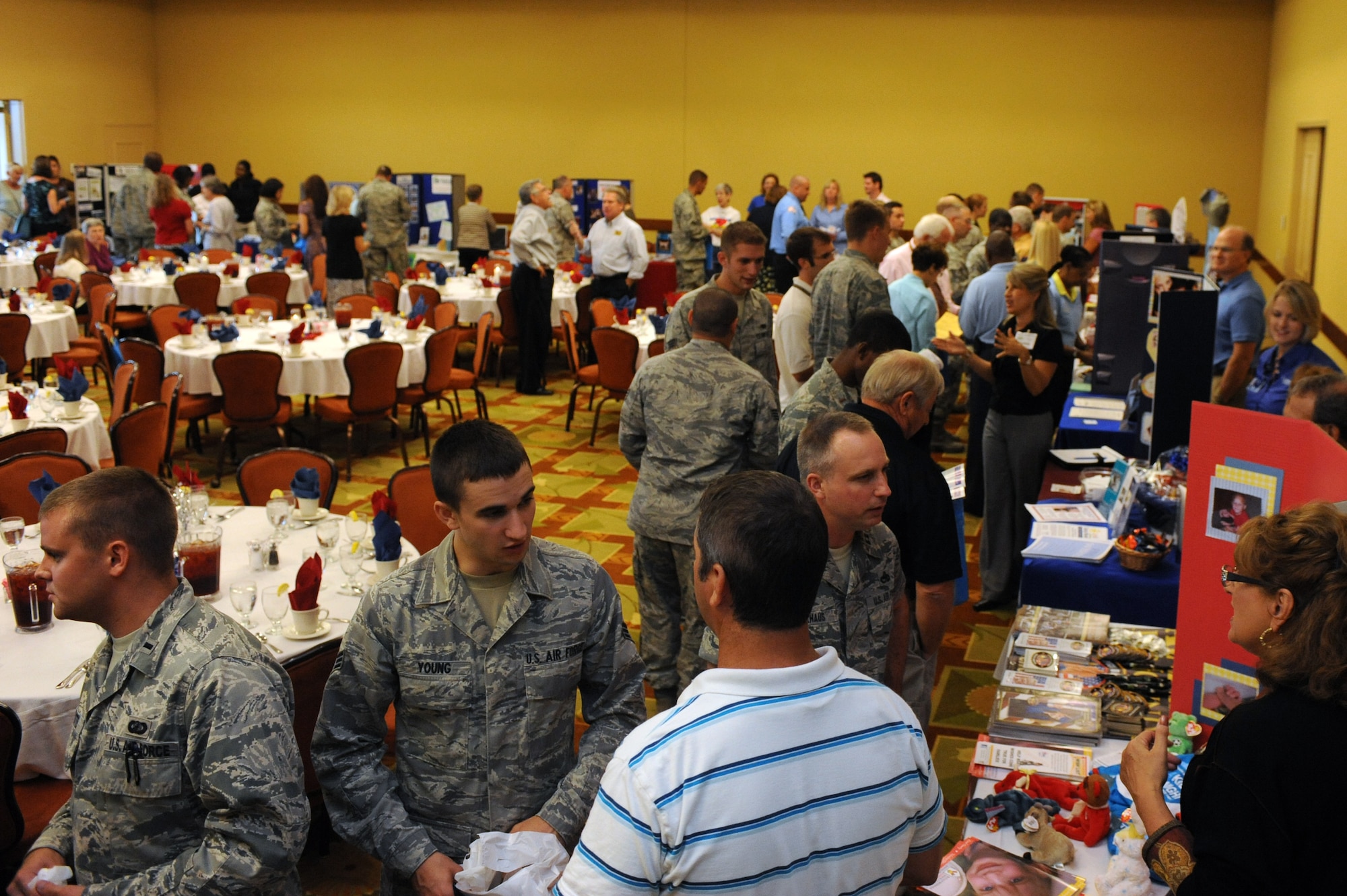 Airmen speak with charities representatives during the 2011 Combined Federal Campaign kick-off at the Soundside club, Hurlburt Field, Fla. Sept.27. Last year Hurlburt Field raised more than $490,800. (U.S. Air Force photo/Senior Airman Eboni Reams)(RELEASED)



