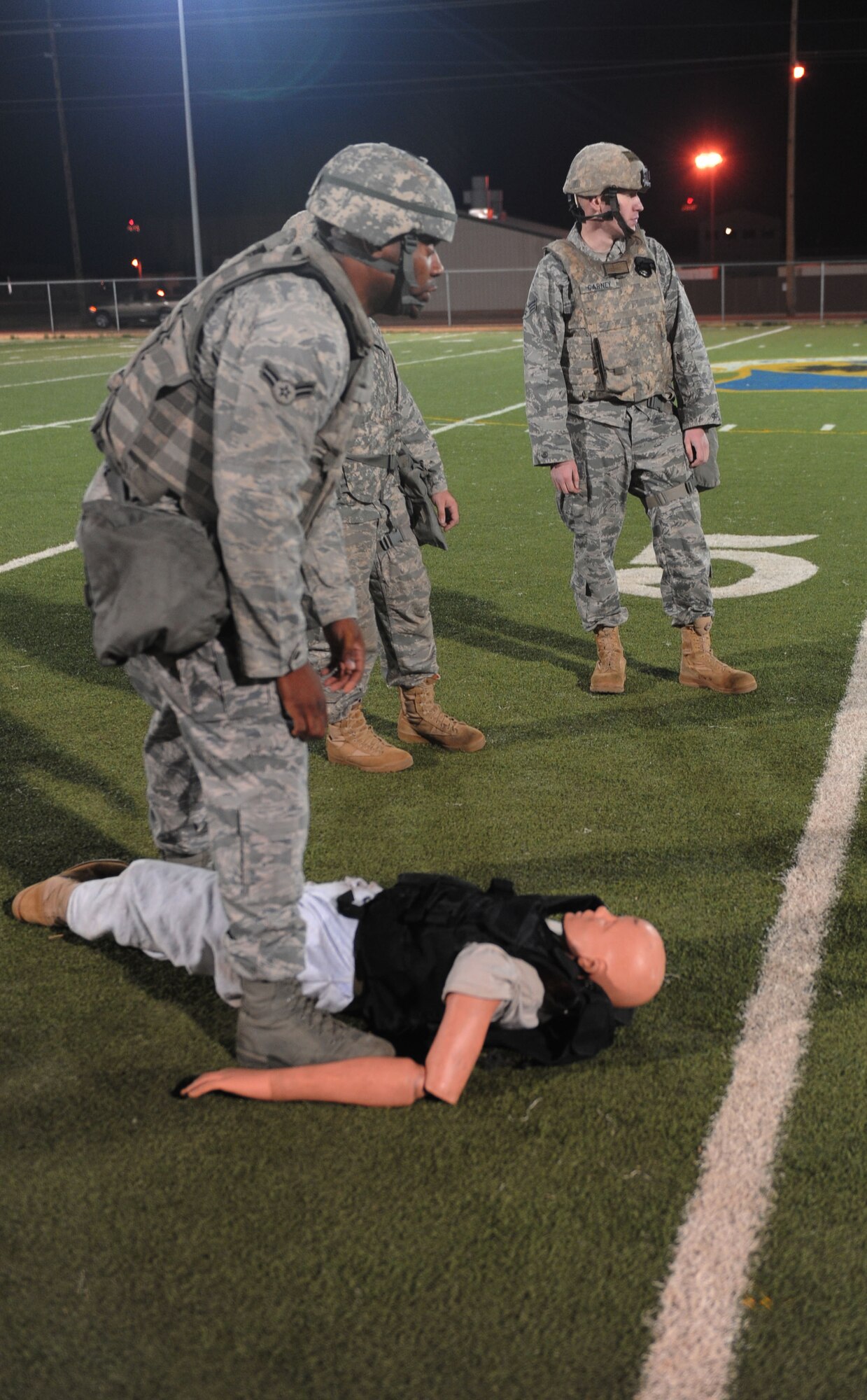 7th Security Forces Squadron airmen get ready for the SFS 2011 Global Strike Challenge team tryouts, Sept. 27, 2011, at Dyess Air Force Base, Texas. The tryouts consisted of a 40-yard shuffle carrying a 210-pound dummy and a half-mile run with full gear on. (U.S. Air Force photo by Airman 1st Class Cierra Bullock/Released) 