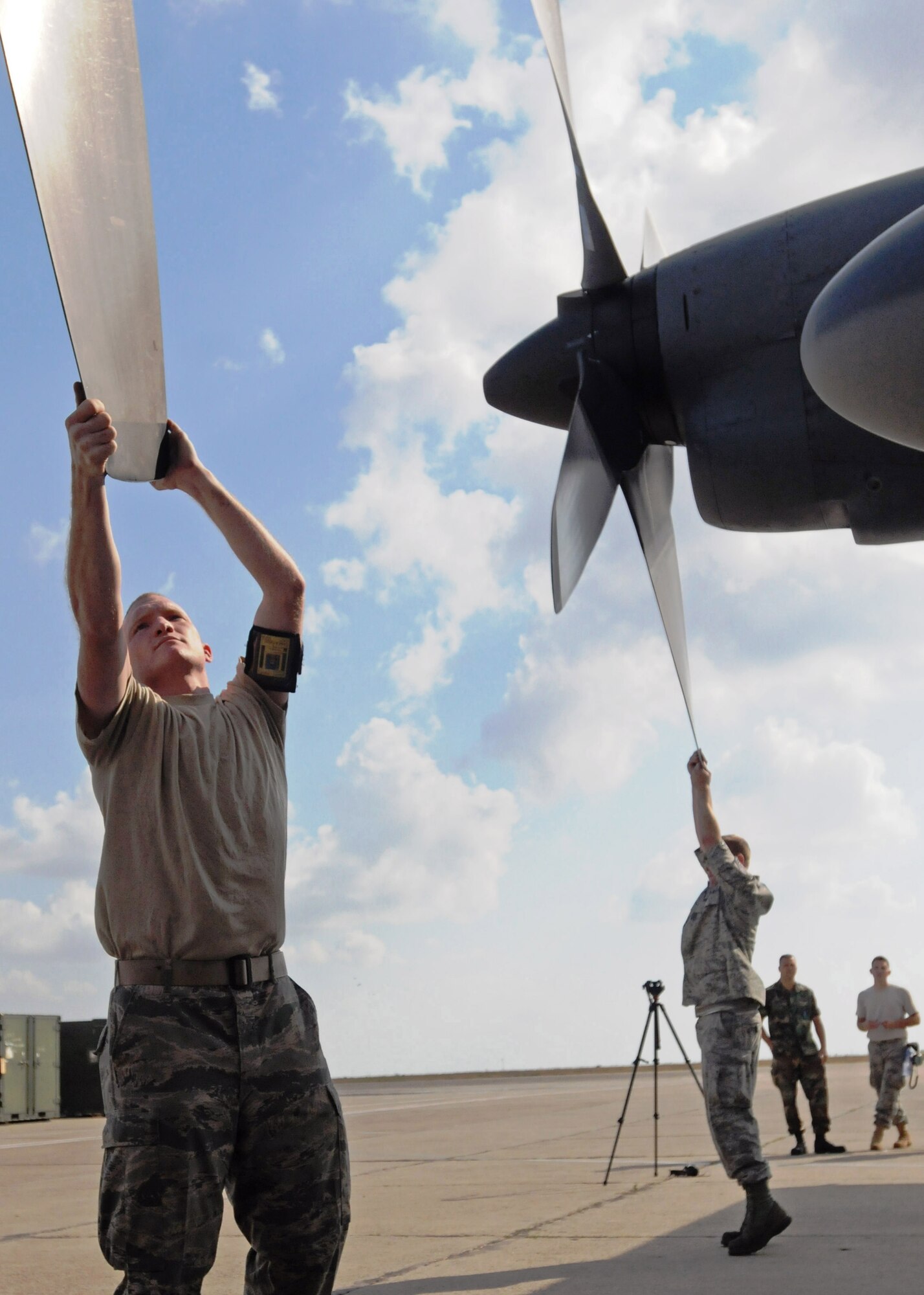 MIHAIL KOG??LNICEANU AIRBASE, Romania ???Senior Airman David Pickren, left, and Tech. Sgt.Johnathan Hasty, right, MC-130H Combat Talon II aircraft crew chiefs with the 352nd Special Operations Maintenance Squadron, RAF Mildenhall U.K., check the propeller blades on their aircraft during Jackal Stone 11 exercise, Mihail Kog??lniceanu Airbase, Romania, Sept. 19, 2011.  The purpose of the exercise, coordinated by Special Operations Command Europe, is to enhance special operations forces capacity and interoperability between the nine participating nations, while simultaneously building cooperation and partnerships.  (U.S. Army photo by Spc. Cody A. Thompson, 40th Public Affairs Detachment)