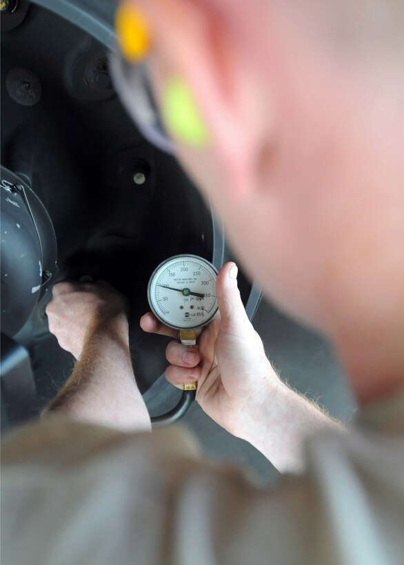 MIHAIL KOG??LNICEANU AIRBASE, Romania ??? Senior Airman David Pickren, an MC-130H Combat Talon II crew chief with the 352nd Special Operations Maintenance Squadron, RAF Mildenhall, U.K, checks the tire pressure of a Combat Talon II during the Jackal Stone 11 exercise on Mihail Kog??lniceanu Airbase, Romania, Sept. 19, 2011.  The purpose of the exercise, coordinated by Special Operations Command Europe, is to enhance special operations forces capacity and interoperability between the nine participating nations, while simultaneously building cooperation and partnerships.  (U.S. Army photo by Spc. Cody A. Thompson, 40th Public Affairs Detachment)
