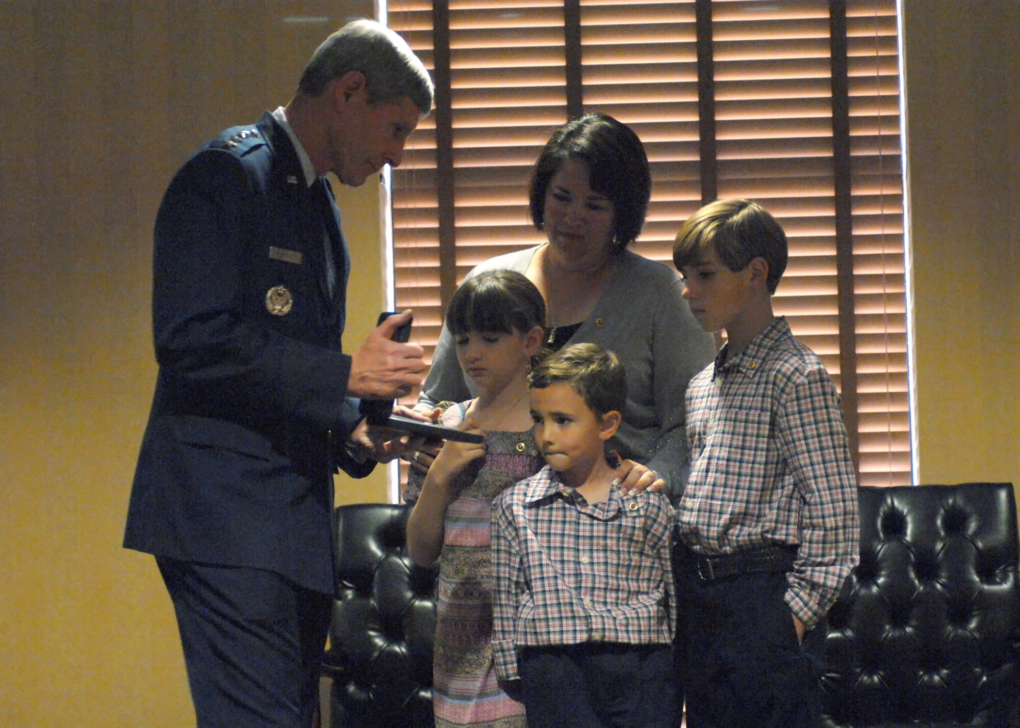 DAVIS-MONTHAN AIR FORCE BASE, Ariz. - Air Force Chief of Staff Gen. Norton Schwartz presents the Silver Star to the family of Capt. Nathan J. Nylander in a ceremony at Davis-Monthan Air Force Base, Ariz., Sept. 24, 2011.  The captain’s wife, Miriam, and their children, (left to right) Elisabeth, Andru and Tyler, accepted the posthumous award for Nylander’s actions at Kabul International Airport in Afghanistan on April 27, 2011.  Nylander engaged an Afghan Air Force officer who was firing on American servicemembers and civilians at the deployed location.  His actions prevented further loss of life at the hands of the gunman. (U.S. Air Force photo/Airman 1st Class Timothy D. Moore)