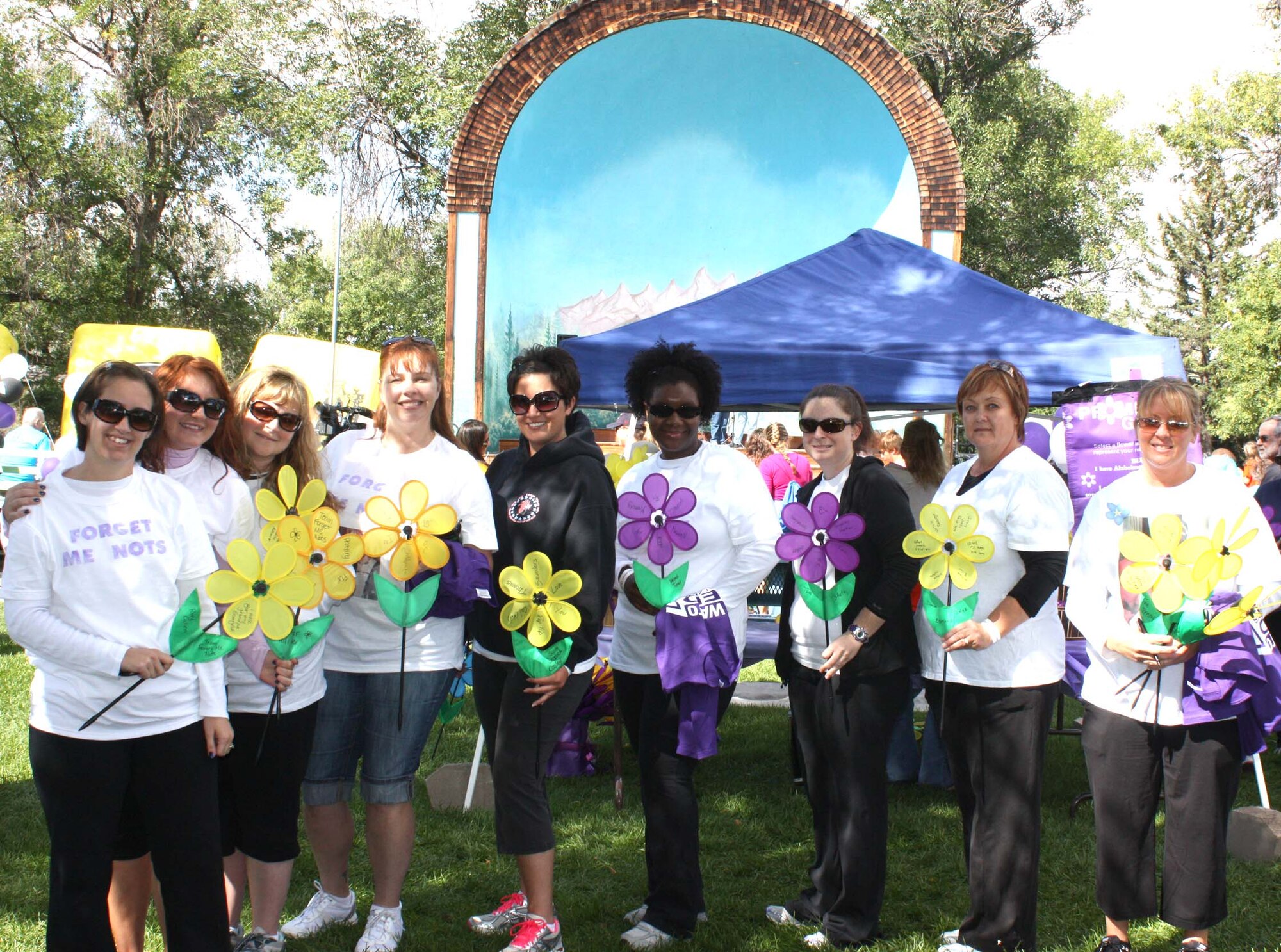 Military spouses from the 819th RED HORSE, 341st Missile Maintenance, 341st Operations Support, 341st Force Support and 341st Civil Engineer Squadrons joined together to form "Team Forget Me Not" to raise funds and participate in the Walk to End Alzheimer's Disease. The event took place Sept. 18 at Gibson Park and the team contributed $1,715 of the $12,498 total money raised. Two of the team members also earned first and third place for top fundraisers. Pictured from left to right are Rory Cullen, Jennifer Hillier, Jennifer McDaniel, Marni Moore (third place with $570 raised), Jessica Cooley, Melanie Turner, Tara Stutz, Donna Esmond and Tina Penny (first place with $610 raised).  (Courtesy photo)