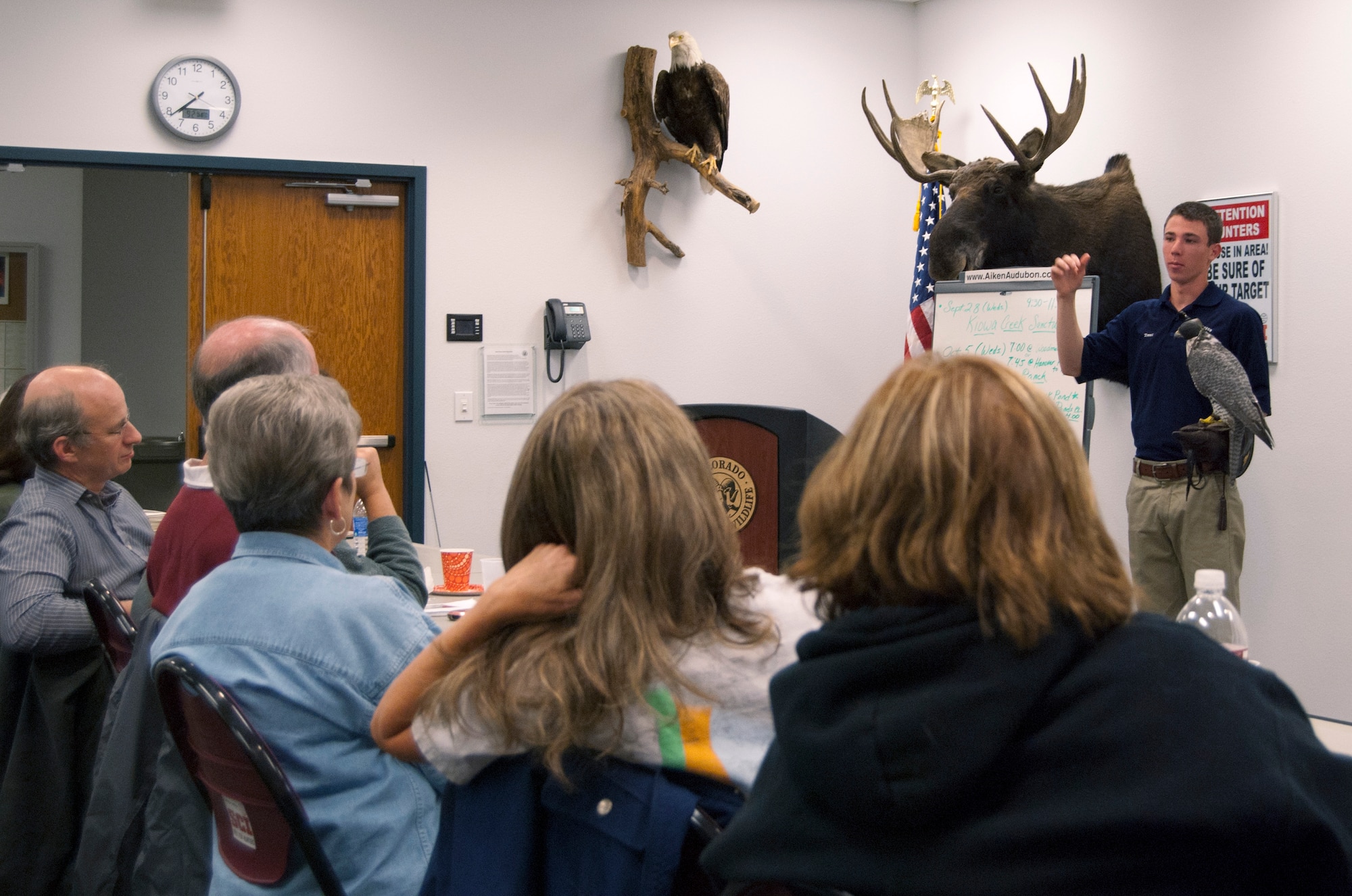 Cadet 3rd Class Trent Grabowski talks about the Air Force Academy's falconry program at a meeting of the Aiken Audubon Society in Colorado Springs, Colo., Sept. 21, 2011. Grabowski and Cadet 2nd Class Cameron Harris, not pictured, provided the 45-minute presentation discussing the birds' care, feeding and training. With Grabowski is Destiny, a gray faced gyrfalcon and one of the Academy's 13 birds of prey. (U.S. Air Force photo/Don Branum)