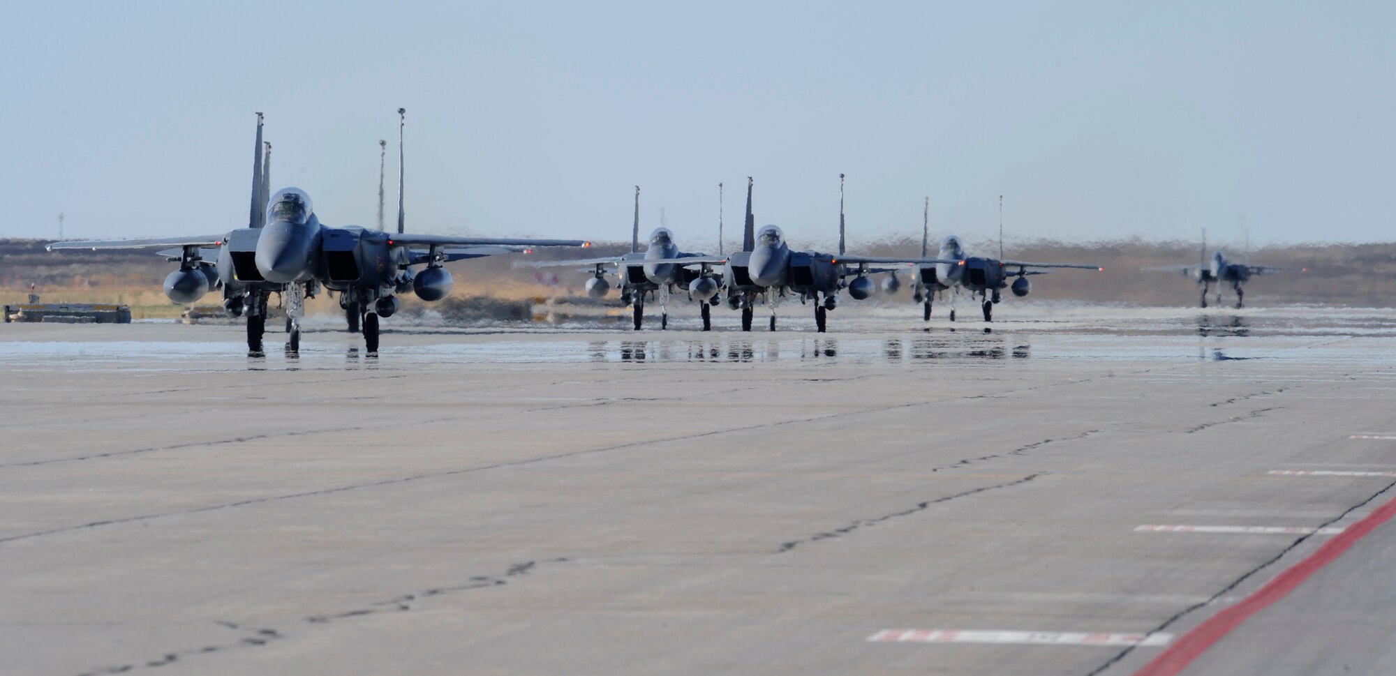 Five F-15E Strike Eagle aircraft from the 389th Fighter Squadron return to Mountain Home Air Force Base Sept 26. As the aircraft taxied down the runway, families were permitted to stand nearby and flood the aircraft shelters to welcome them home. (U.S. Air Force photo by Senior Airman Angelina Drake)
