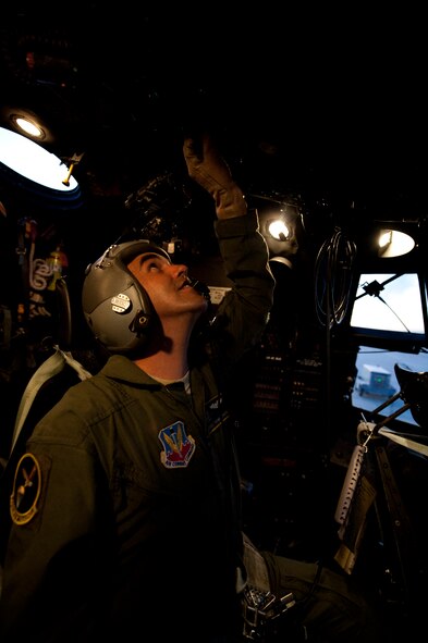 Staff Sgt. Thomas Sinon, 79th Rescue Squadron flight engineer, runs pre-flight checks on the communication box for a HC-130P Combat King prior to a night time training mission at Davis-Monthan Air Force Base, Az. on Sept. 23, 2011. The flight engineers help pilots make decisions on aircraft systems and flight operations and safety. (U.S. Air Force photo by Staff Sgt. Joshua J. Garcia/Released)