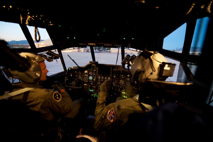U.S. Air Force Capt. Scott Swigert, left, and 1st Lt. Nelson Willingham, 79th Rescue Squadron pilots, run through pre-flight procedures prior to a training mission at Davis-Monthan Air Force Base, Az. on Sept. 23, 2011. Members of the 79th RQS train alongside their sister squadrons, the 55th and 48th Rescue Squadrons, to ensure that they are mission capable and ready. (U.S. Air Force photo by Staff Sgt. Joshua J. Garcia/Released)