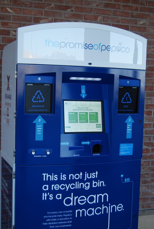 The new Dream Machine recycling kiosk outside the Peterson Base Exchange offers users points in exchange for recycling aluminum and plastic. Points can be redeemed for travel, dining, and entertainment. A kiosk is also located outside the shoppette. (U.S. Air Force photo/Lea Johnson)