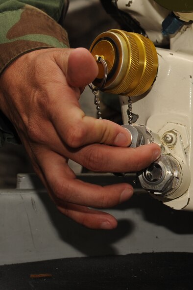 Senior Airman Hugo Garcia, 372nd Training Squadron instructor, presses the bleed button during a classroom session at Seymour Johnson Air Force Base, Sept. 23, 2011. The bleed button releases pressure in the airframe mounted accessories drive to help start an aircraft. The 372nd Training Squadron teaches future F-15E crew chiefs and provides a refresher course for those that have been away from the flightline for an extended period of time. Garcia is a native of Parlier, Calif. (U.S. Air Force photo by Senior Airman Whitney Lambert)