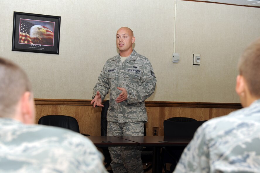 Staff Sgt. Shane Sponsler, 372nd Training Squadron instructor, speaks with students during a classroom session at Seymour Johnson Air Force Base, Sept. 23, 2011. The students were taught the importance of servicing parts on a jet. After students have been taught servicing, they practice on a jet to ensure proper understanding. The 372nd training squadron is a detachment from Sheppard Air Force Base, Texas, and is a secondary technical training location for Airmen who will work on F-15s at their first duty station. Sponsler is a native of Chariton, Iowa. (U.S. Air Force photo by Senior Airman Whitney Lambert) 