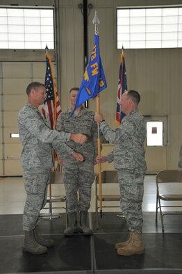 Lt. Col. Joseph Schulz accepts the 178th Mission Support Group banner from Col Greg Schnulo, 178th Fighter Wing Commander at the 178th Fighter Wing Mission Support Group Change of Command Ceremony, Sept. 18, 2011 at the Springfield Air National Guard Base, Ohio