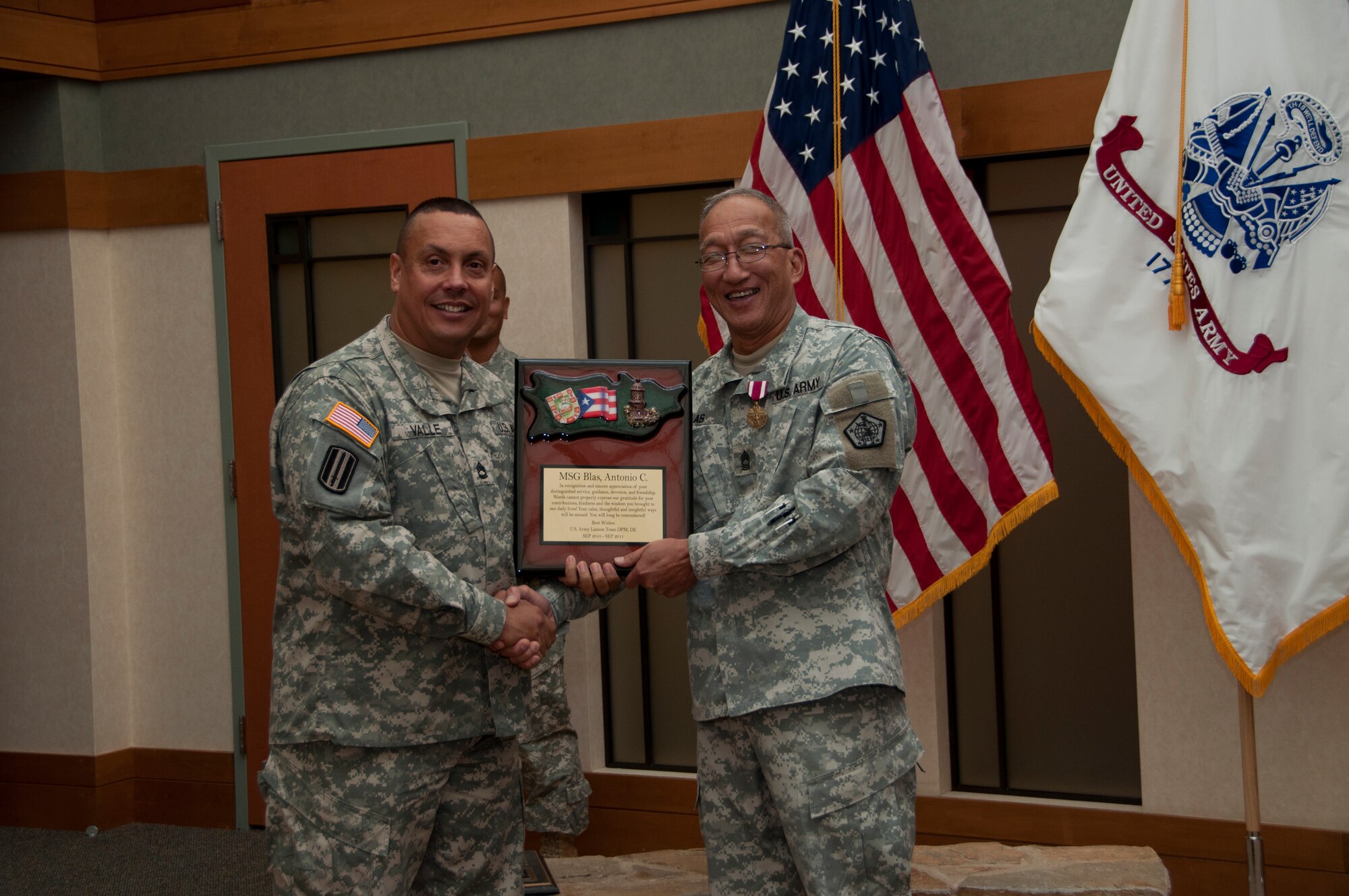 Army Master Sgt. Antonio Blas, Army liaison NCO in charge, Air Force Mortuary Affairs Operations, is honored in a retirement ceremony at the Charles C. Carson Center for Mortuary Affairs, Dover Air Force Base, Del., Sept. 21, 2011. Blas served 32 years with the Army. (U.S. Air Force Photo/Staff Sgt. Agustin Salazar)