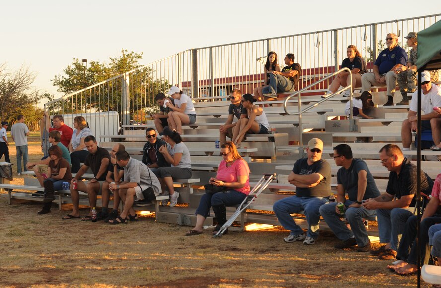 Airman Derek Sawyer, 7th Communications Squadron, and his wife Vanessa enjoy comedy entertainment by The Comics on Duty World Tour, Sept. 23, 2011, at Dyess Air Force Base, Texas. This event, also known as Comedy Under the Stars attracted many people to include Airmen and their families as well as retired military members. (U.S. Air Force photos by Airman 1st Class Cierra Bullock/Released)