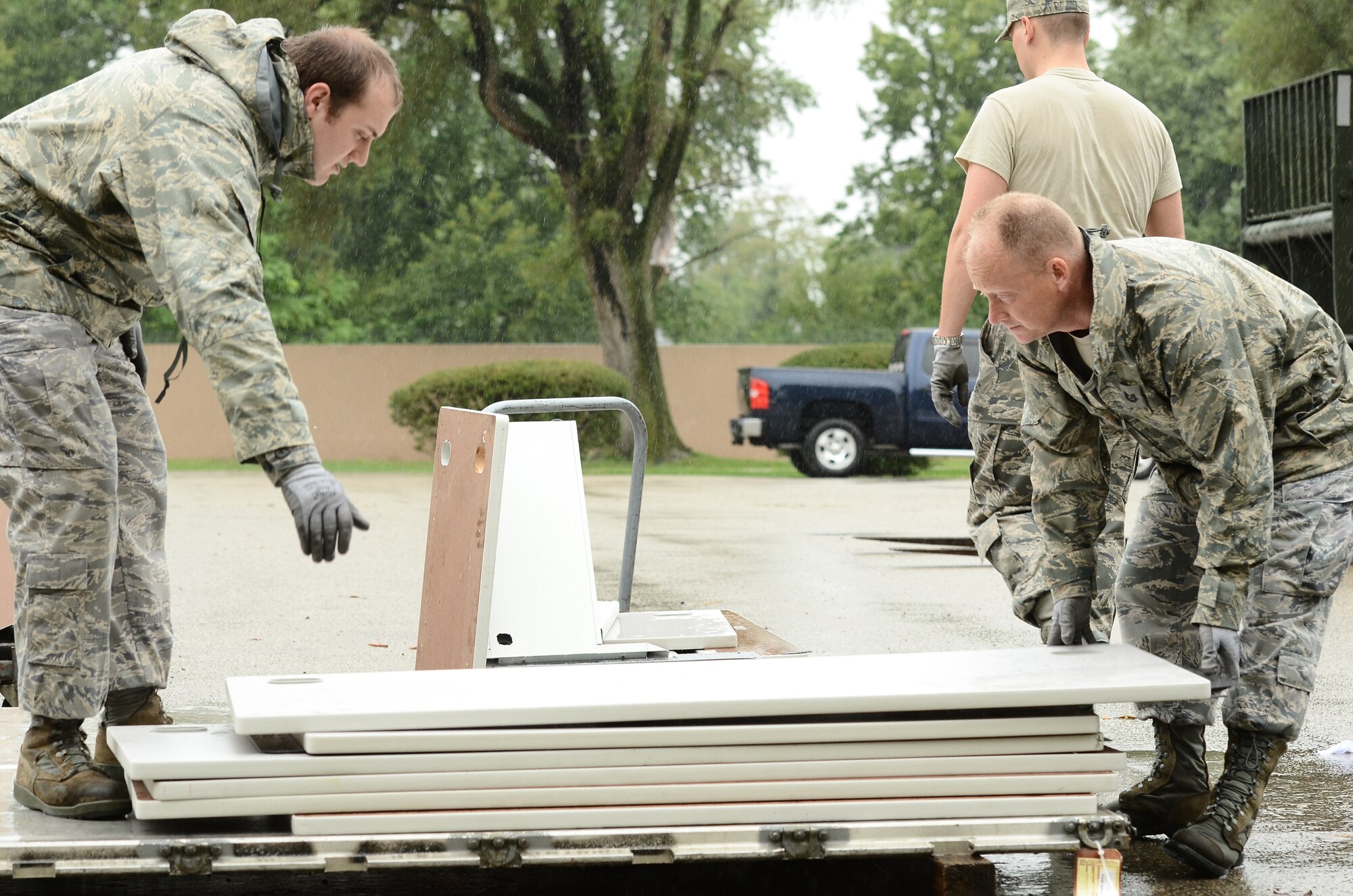 WRIGHT-PATTERSON AIR FORCE BASE, Ohio – From left to right, Senior Airman Daniel Burden and Tech. Sgt. Donald Griffen, both from the 87th Aerial Port Squadron, build a pallet of workstations Sept 7 that is being put into storage for the wing until upcoming renovations to wing facilities are complete. (U.S. Air Force photo/Senior Airman Mikhail Berlin)