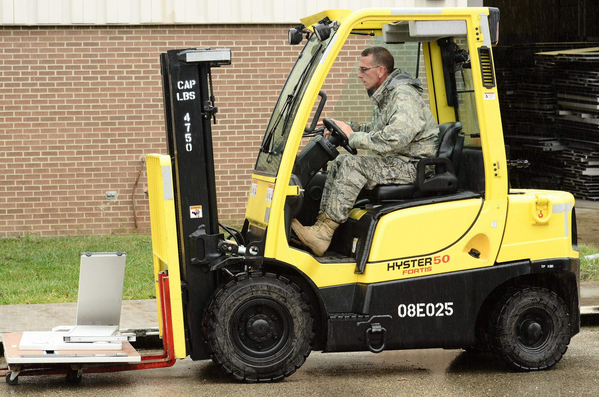 WRIGHT-PATTERSON AIR FORCE BASE, Ohio – Senior Master Sgt. Ed Kirker, 87th Aerial Port Squadron, helps build a pallet of workstations Sept. 7 going into storage until upcoming renovations to the wing are complete. (U.S. Air Force photo/Senior Airman Mikhail Berlin)