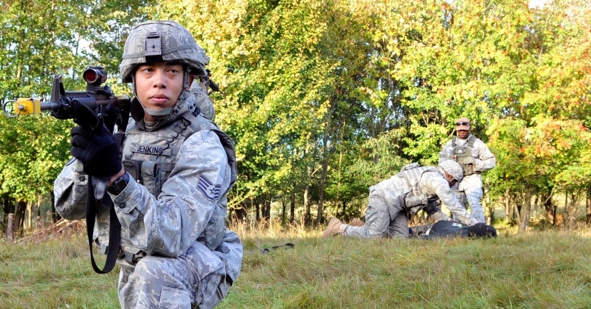 U.S. Air Force Staff Sgt. Kevin Jenkins, 569 th Security Forces Squadron, stands guard and performs 360 degree surveillance of the area as an oppositional force is searched during Creek Defender training course Sept. 22 in Baumholder, Germany. Security Forces members from throughout U.S. Air Forces Europe attended the training course in preparation for deployment. (Photo by Staff Sgt. Tyrona Lawson)


